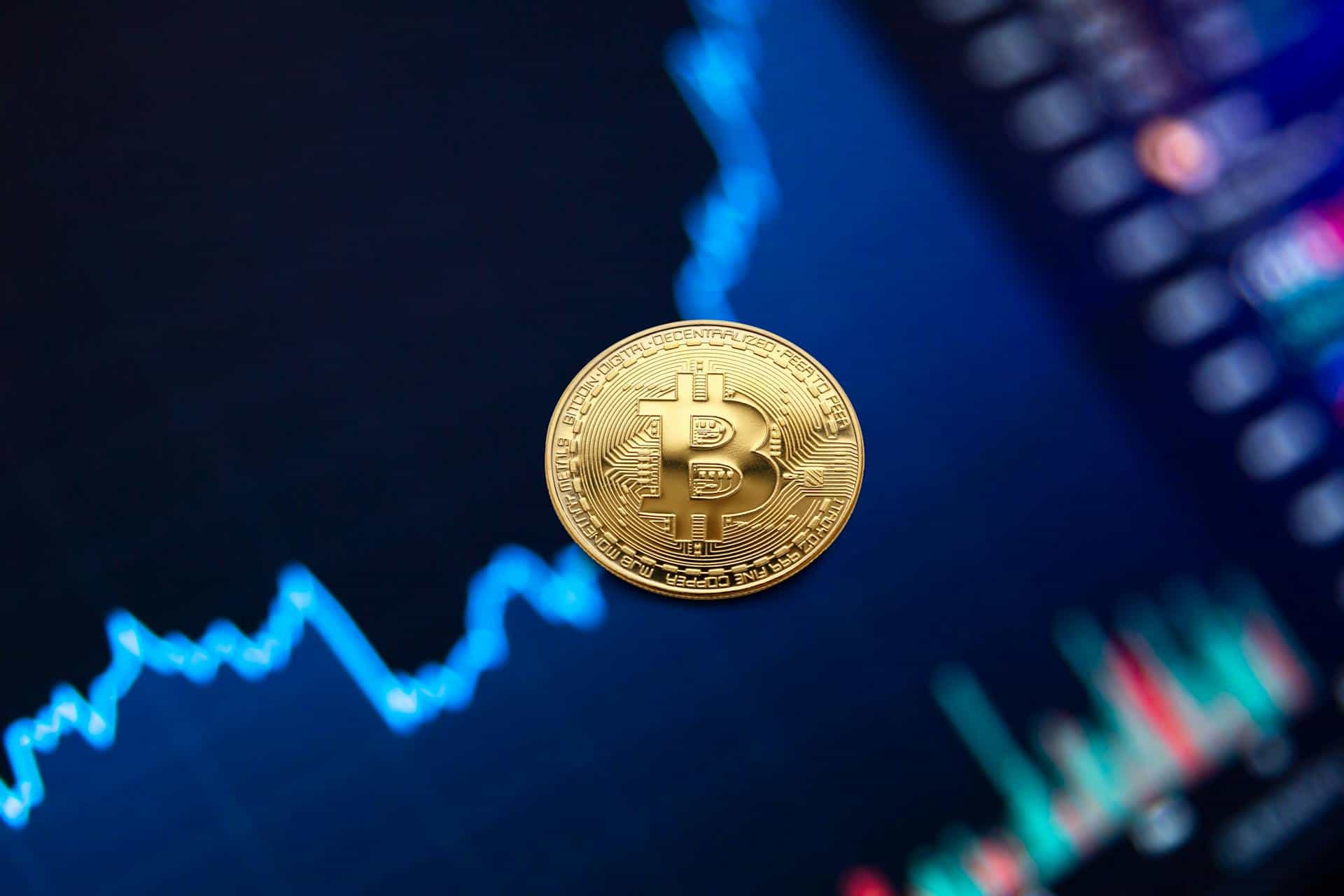 Bitcoin coin beside computer hardware