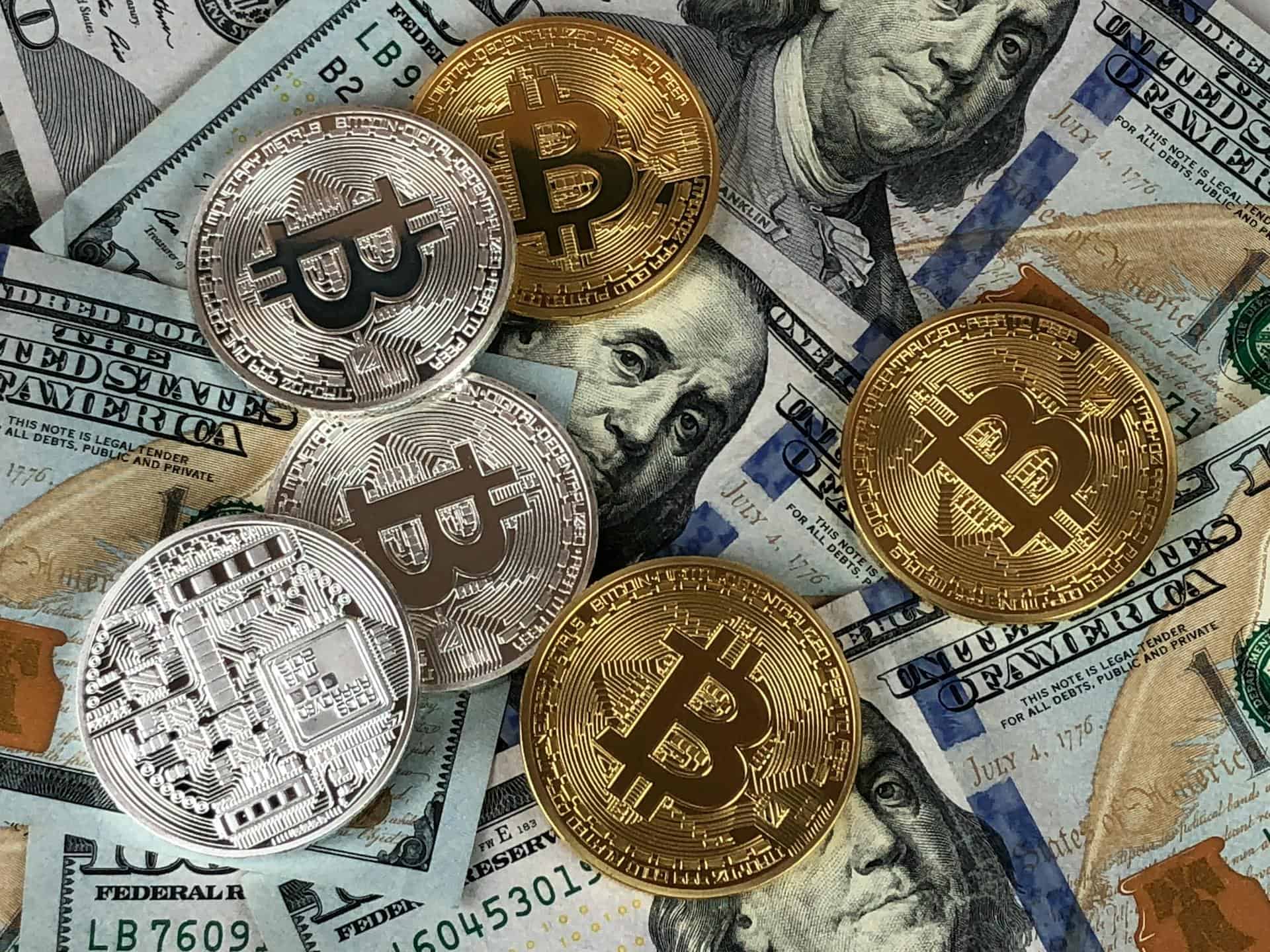Physical Bitcoin tokens on a blue surface
